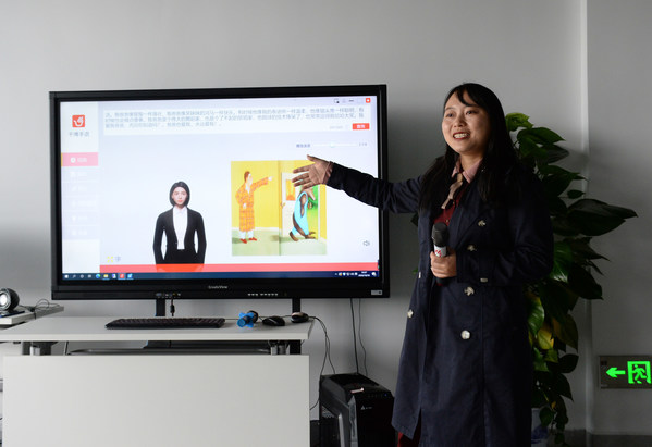 Staff in Qianbo Information Technology Co. Ltd. is introducing "virtual sign language anchor" technology.