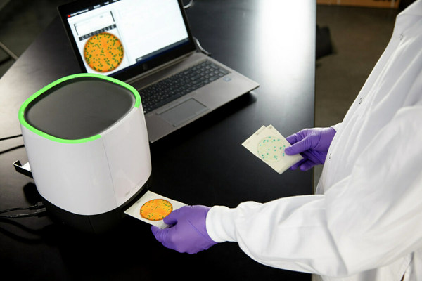 The 3M Petrifilm Plate Reader Advanced can improve laboratory efficiency with fixed artificial intelligence (AI) networks to enumerate 3M Petrifilm Plates, which can get users results in 4–6 seconds, or up to 900 plates per hour. The 3M Petrifilm Plate Reader Advanced provides accurate colony counting with proactive, easy-to-use software that simplifies results storage and data analytics, plus produces automated data and reports. (PRNewsFoto/3M)