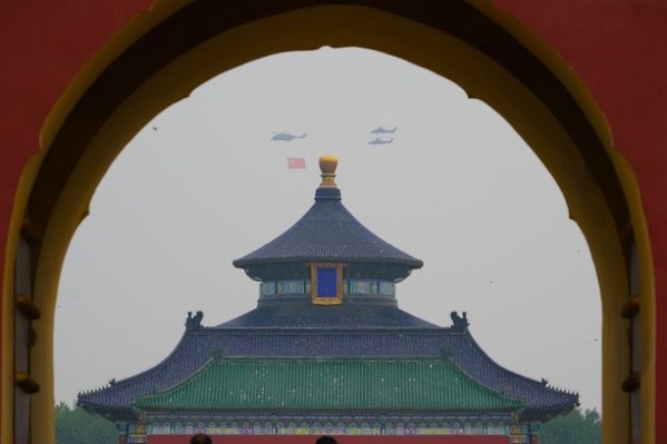 1 Helicopters carrying the Party flag fly over the Temple of Heaven in celebration of the centenary of the CPC in Beijing on July 1, 2021. [Photo by Su DongFor China Daily]