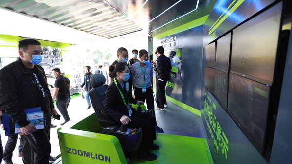 A Zoomlion employee demonstrates its 5G Tower Crane Remote Intelligent Control System at the 2021 Changsha International Construction Equipment Exhibition (CICEE)