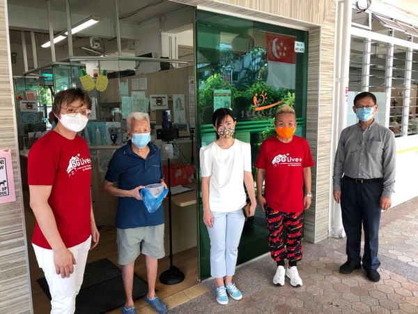 Ms Tin Pei Ling (Center) with volunteers at GEHA