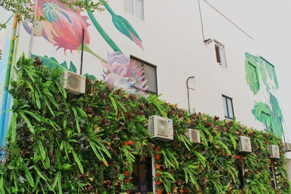 The mural by Myra, a property developer, features art in the form of living plants, a tapestry of life formed from ferns, miniature potted plants and other leafy faunas.