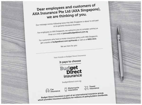 The Budget Direct Insurance advert that appeared in the Straits Times newspaper inviting customers and employees of AXA Singapore to get in touch.