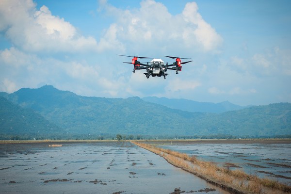XAG Agricultural Drone broadcast seeds into a rice paddy of Vietnam