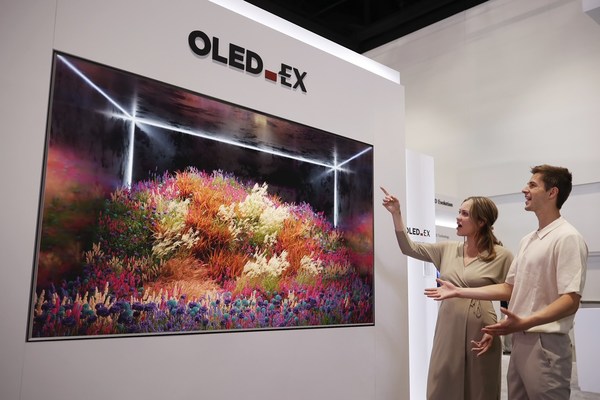 LG Display unveils 97-inch OLED.EX TV display, the biggest of its kind, during SID 2022.