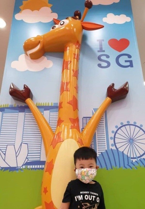Young Brandon, posing in the winning picture of Geoffrey’s World Tour photo contest, recognizes all Toys"R"Us stores, no matter which outlet his parents bring him to!
