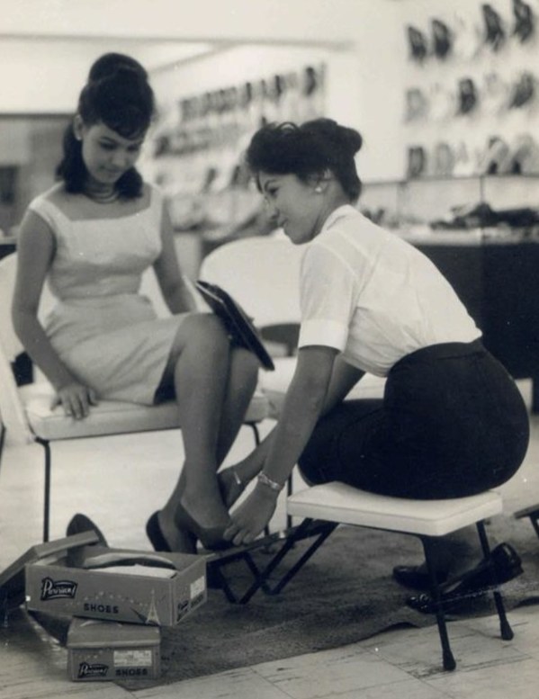 A customer is helped by an SM saleslady in one of SM’s earlier stores in Rizal Avenue in the 1950s