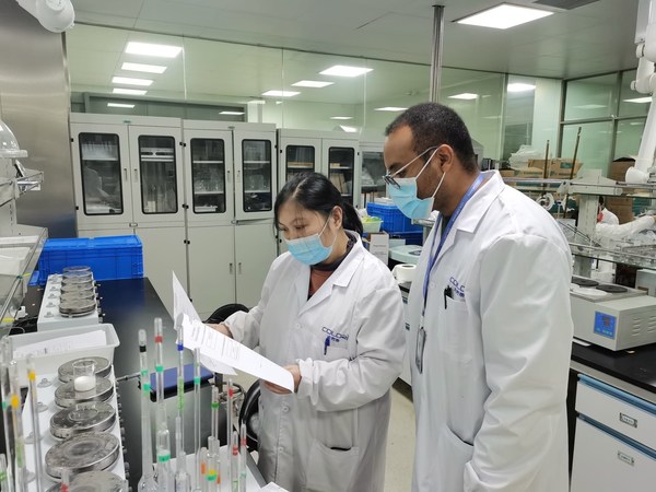 Daniel Tolessa Negera (right), an Ethiopian student at Hefei University of Technology, conducts a product quality test at a cosmetics laboratory in Suzhou, Jiangsu province.