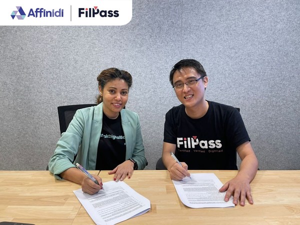 Varsha Jagdale, General Manager of Financial Services in Affinidi (left) and Ryan Soh, Founder and Chief Executive of FilPass (right) sign MOU to mitigate risk of fraudulent identification claims in the Philippines