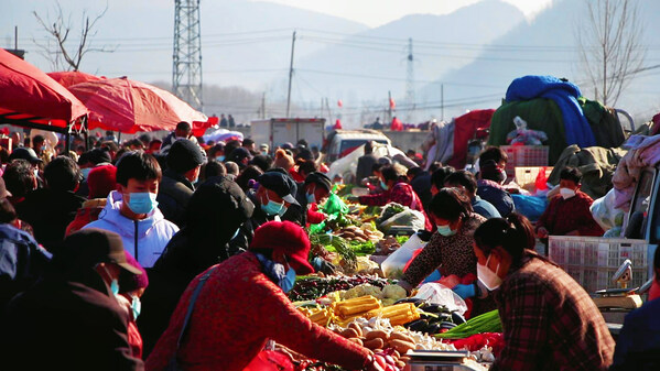 Residents in Zaozhuang, Shandong province flock to a local bazaar in preparation for upcoming Chinese New Year, or Lunar New Year.