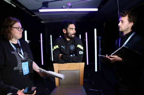 OKX ambassador İlkay Gündoğan (centre) speaks with OKX’s Peta Cooper (left) and City AM’s Louis van Boxel-Woolf (right) following a content shoot for the OKX Collective metaverse