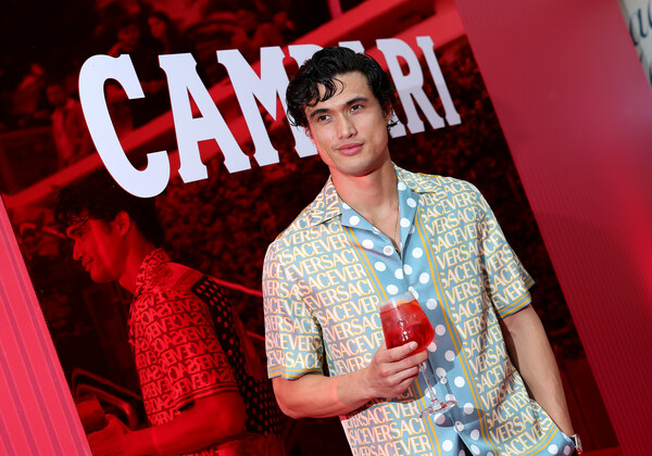 Actor Charles Melton enjoys a Campari aperitif at Campari: Discover Red event experience ahead of his premiere for May December at the 76th Annual Festival de Cannes.