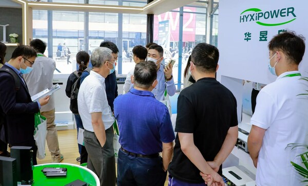 A HYXiPOWER representative demonstrates the firm’s PV Inverters and energy storage