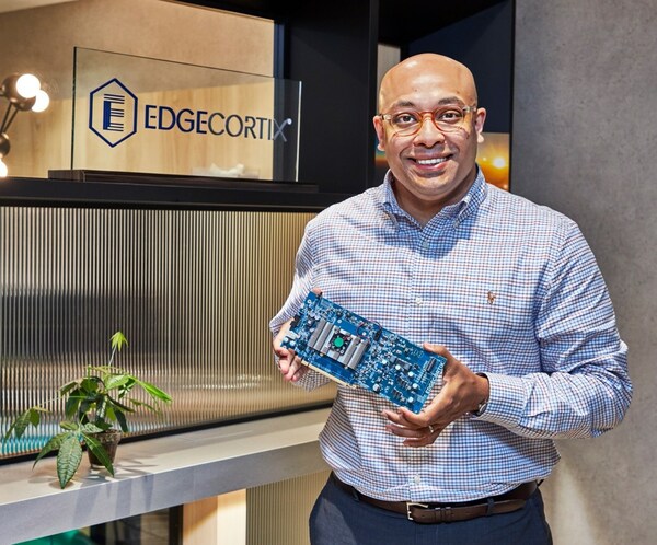 EdgeCortix founder and CEO Dr. Sakyasingha Dasgupta poses for a picture with their latest SAKURA AI processor enabled machine learning system for power-efficient inference at the edge, from vision to generative AI applications.