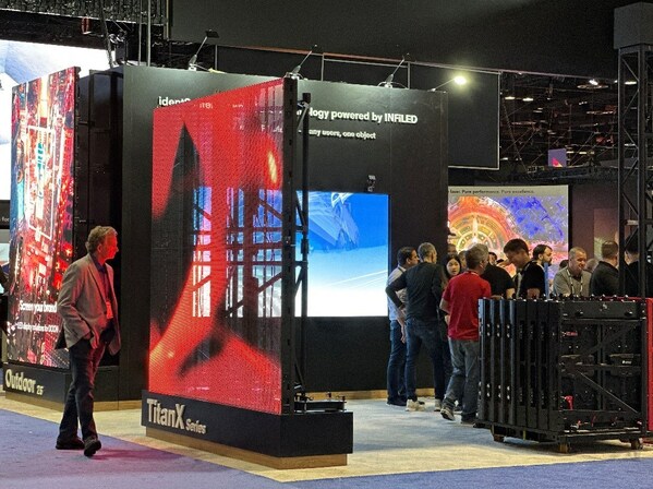 A Titan-X series screen was shown on the left of the picture and a cart with the Atlas-X series cabinets on the right