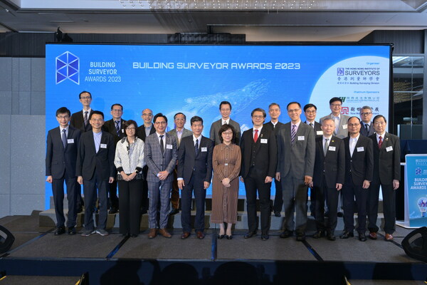 Group photo of (first row from left) Mr CHUA Hoi-wai, JP, Chief Executive, The Hong Kong Council of Social Service, Dr CHEUNG Tin-cheung, SBS, Chairman, Hong Kong Green Building Council, Ms YU Po-mei, Clarice, JP, Director of Buildings, Buildings Department, HKSAR Government, Sr Kenny TSE Chi-kin, Chairman of Organising Committee of BSA 2023, Sr Paul WONG Kwok-leung, President of The Hong Kong Institute of Surveyors, Ms Bernadette LINN Hon-ho, JP, Secretary for Development, HKSAR Government, Sr Arthur CHEUNG Man-to, Chairman of The HKIS BSD, Mr TSE Cheong-wo, Edward, JP, Director of Architectural Services, Architectural Services Department, HKSAR Government, Sr Prof HO Chi-wing, Daniel, Professor and Associate Dean, Faculty of Design and Environment, Technological and Higher Education Institute of Hong Kong (THEi), Sr CHOI Shing-lam, Sunny, Chairman, Quantity Surveying Division, The Hong Kong Institute of Surveyors, Ir C S HO, Chairman, Hong Kong Quality Assurance Agency, (second row from left) Prof WONG, Kelvin S K, Department of Real Estate and Construction, Faculty of Architecture, The University of Hong Kong, Sr TANG Hoi-kwan, Edwin, Past President, The Hong Kong Institute of Surveyors, Mr LEUNG Kin-man, Stephen, JP, Deputy Director (Development & Construction), Housing Department, Ir Thomas HO On-sing, JP, Chairman, Construction Industry Council, Mr HO Chun-hung, JP, Deputy Director of Buildings, Buildings Department, HKSAR Government, Mr. LAM Sair-ling, HKIA CIOH HKICON Reg.Architect RPHM AP, Head of Property, Caritas Hong Kong, Mr Barry SIN, Immediate Past Vice-President (Building), Hong Kong Construction Association, Sr Prof. WONG Bay, Founding Member and Past President, The Hong Kong Institute of Surveyors and Ir Prof. Michael C. H. YAM, Head of Department of Building and Real Estate, The Hong Kong Polytechnic University.