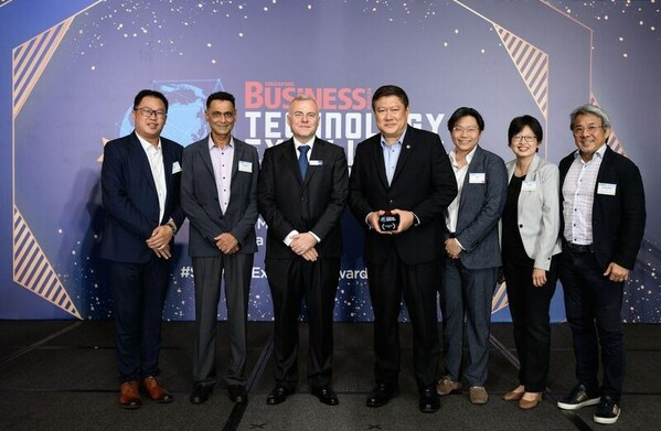 Dr Jack Hong, Founder and CEO of Integrum Global (third from right) at the Singapore Business Review Technology Excellence Awards with members from EVCo and Origin Exterminators last month, receiving an award in the category of AI-Environmental Services.