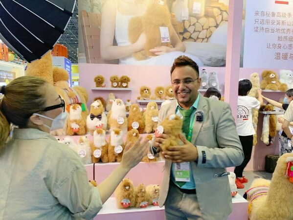 Booth of BBFAT, a Peruvian brand of handmade alpaca wool products, at the fifth China International Import Expo (CIIE)
