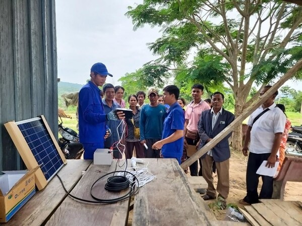 The local CHINT and SchneiTec team in Cambodia training the villagers at Ou Thom on the usage and benefits of Home Solar System.