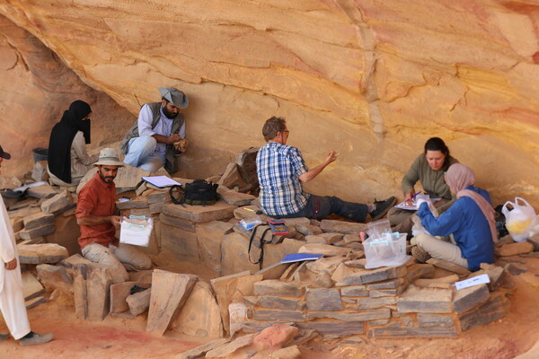 The team led by Dr Wael Abu-Azizeh excavates the chamber that contained “an exceptional discovery” of skull and horn fragments. Credit: Muhammad Al-Dajani / RCU