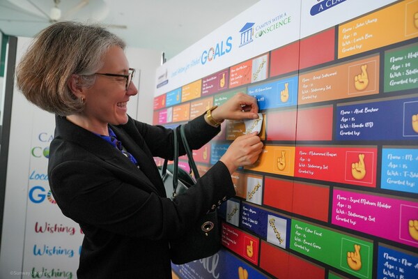 Photo 3: HE Ailsa Terry UK High Commissioner to Malaysia granting a child's wish through the Wishing Wall