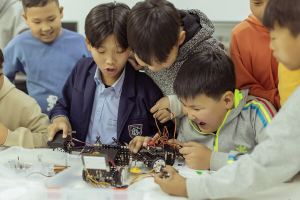 Pure joy radiates as these young minds celebrate their first triumph in robotic coding at Unitel HUB (PRNewsfoto/Unitel Group)