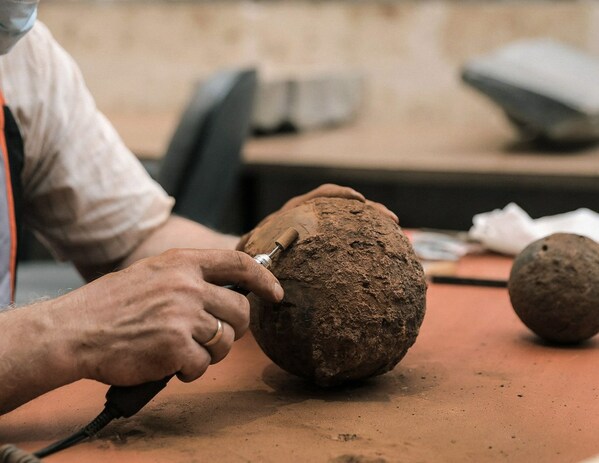 Iron round shot (cannonball) during conservation in the laboratory of JHD's General Department of Archaeology