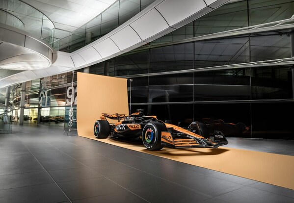 A diagonal view of the MCL38 race car featuring OKX branding