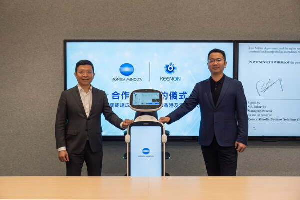 Mr. Robert Ip, Managing Director at Konica Minolta Business Solutions (HK) Ltd (left) and Mr. Gary Liao, Senior Vice President, International Business at KEENON Robotics (right) with DINERBOT T10