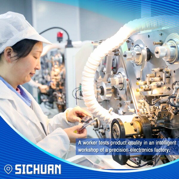A worker tests product quality in an intelligent workshop of a precision electronics factory.