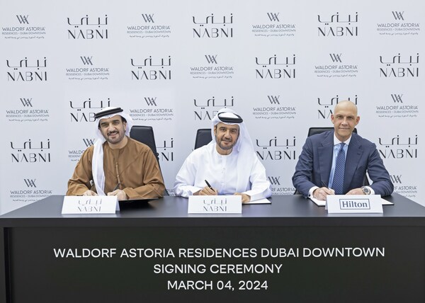 Signing of Waldorf Astoria Residences Dubai Downtown - (Left to Right) Abdulrahman Alsuwaidi, co-founder and chairman of NABNI Developments; Badr Alsuwaidi, co-founder and CEO of NABNI Developments; and Daniel Wakeling, vice president of development, luxury & residential – Europe and Africa, Hilton