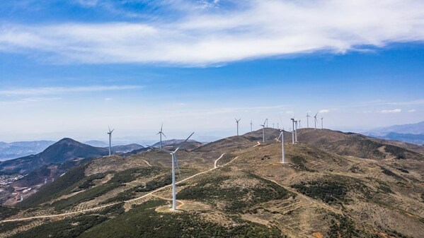 Aerial photo taken on April 26, 2020 shows power-generating windmill turbines in Weining County, southwest China's Guizhou Province. [Photo by Tao Liang/Xinhua]