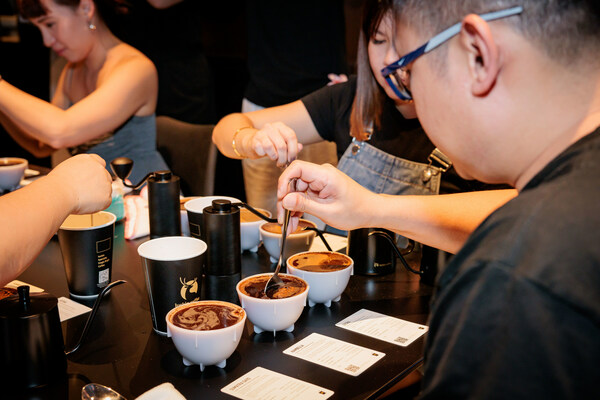 Participants performing coffee cupping, tasting the different flavours of Luckin Coffee’s SOE beans