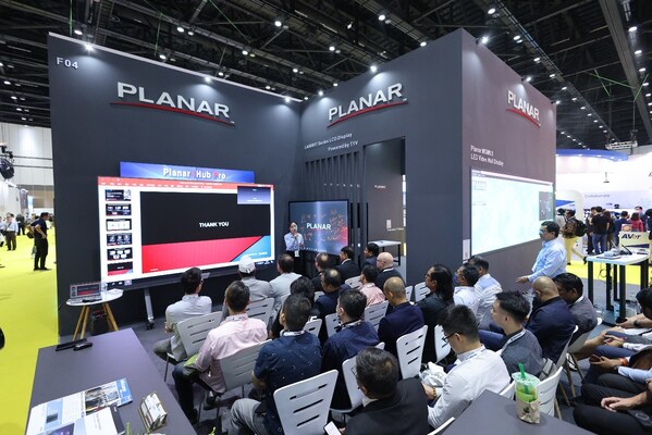 [InfoComm Asia, visitors attending in-booth workshops on the show floor]