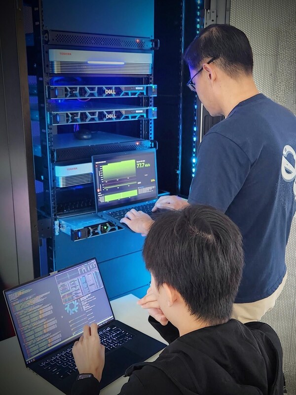SpeQtral's Quantum Security Architect, Mr. Cyril Tan and Quantum Networks Solutions Engineer, Mr. Jeshua Lin, configuring the Toshiba QKD systems and Quantum Key Management Systems