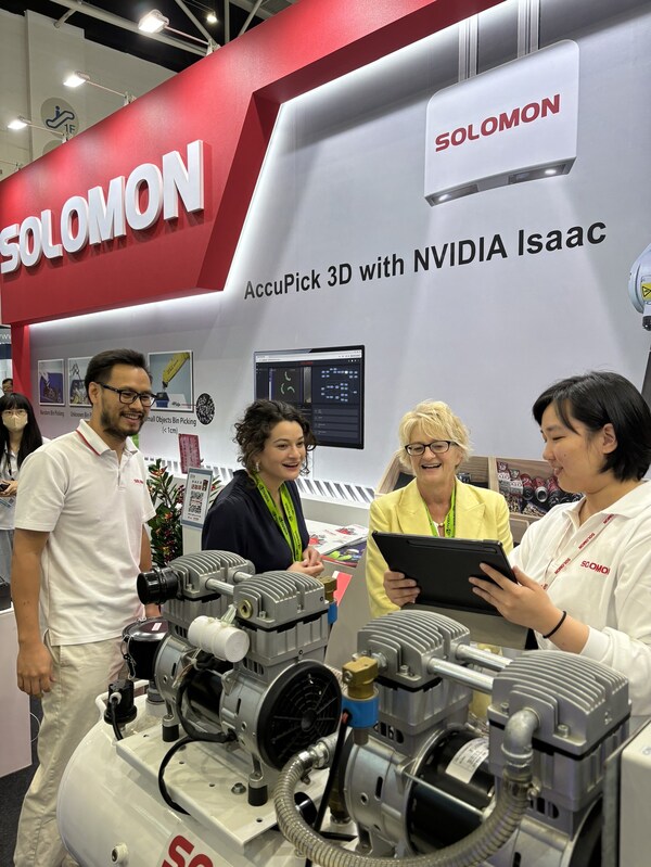 At COMPUTEX 2024, Solomon's VP of Research & Development, Xuan-Loc Nguyen, introduces the META-aivi AR + AI vision system for SOP validation to visiting NVIDIA guests Madison Huang and Lori Huang.
