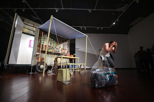 Art performance by the collective group Rumah Ada Seni from Indonesia in front of their work titled “Garobak Galeri” during the opening of the IMT-GT: Rantau Exhibition.