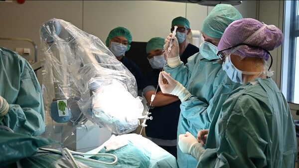 NaoTrac reached to the lesion and neurosurgeon is taking out the tissue sample.