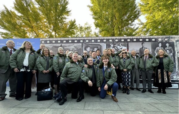 The delegation of the Sino-American Aviation Heritage Foundation attended a Flying Tigers historical photo exhibition in Beijing on Oct. 302023.(Photo by Zhang Penghui/People's Daily)