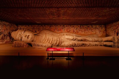 Cave 158, a renowned Nirvana cave in the Mogao Caves, features a 15.8-meter-long Buddha statue with a serene expression and a slight smile.