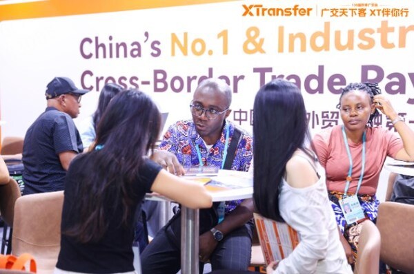 African buyers inquiring at the XTransfer booth during the 136th Canton Fair