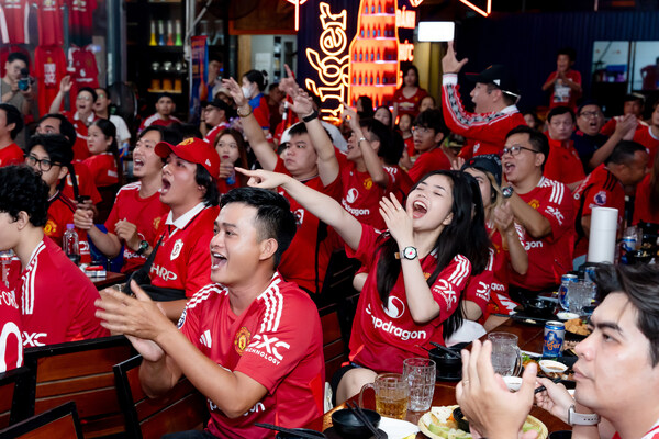 Manchester United fans erupt in cheers at a live match viewing party in Vietnam