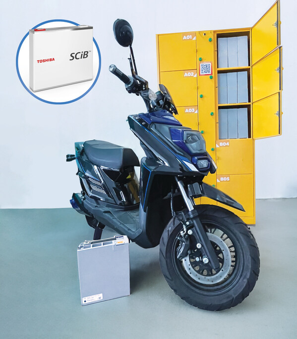 The battery pack using SCiB™ cells and battery charging locker used in the demonstration test, with a motorcycle