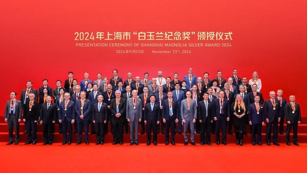 Recipients of the 2024 Magnolia Silver Award pose for a group photo at the award ceremony held in the Grand Halls, Shanghai, on Nov 23. [Photo provided to english.shanghai.gov.cn]