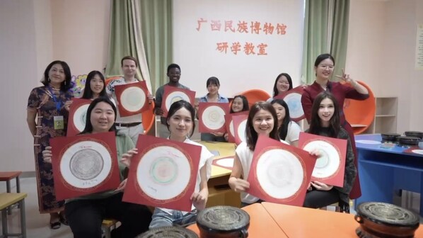 Gen Zers representatives display ethnically inspired artworks at Guangxi Museum of Nationalities.