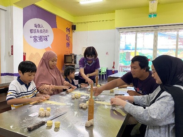 Muslim participants crafting taro pastries by hand.