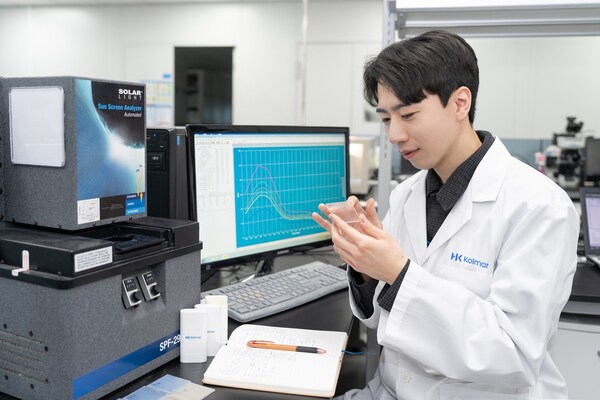 A researcher is studying UV protection at Kolmar Korea's UV Tech Innovation Lab.