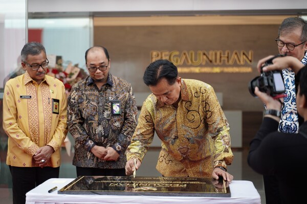 Government Official Signing the Inscription