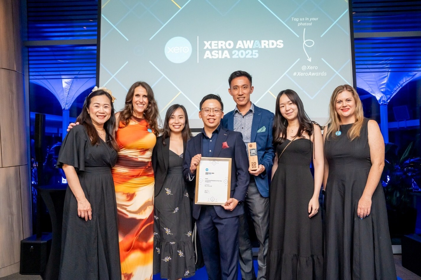 From left to right: Esther Li, Koren Wines (Managing Director, Xero Asia), Teo Shiu Wen, Tan Li Han  (Founding Partner, WLP Group), Neo Peng Hong, Tricia Ting, Sarah Foo (Head of Sales, Xero Asia).  The photograph was taken during the Xero Asia Awards 2025, where WLP Group was honoured as the e-  Invoicing Champion of the Year (Singapore) for its exceptional dedication to helping businesses adopt  and benefit from digital e-invoicing solutions.  (Photo: Xero Asia Awards 2025)