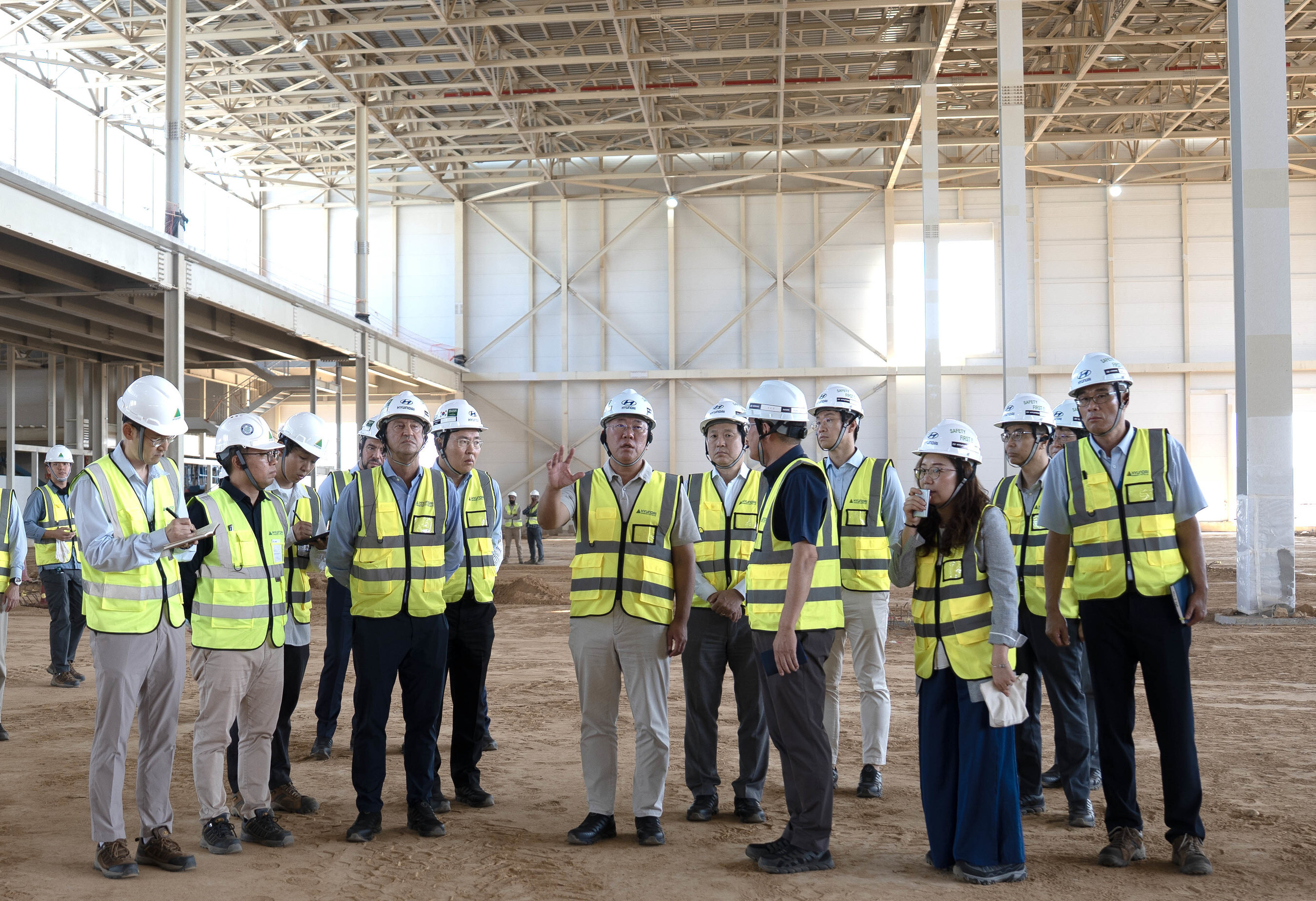 Executive Chair Euisun Chung and José Muñoz, President and CEO of Hyundai Motor Company, are briefed by HMMME Head Wonkyn Park on the progress of the new plant in Saudi Arabia
